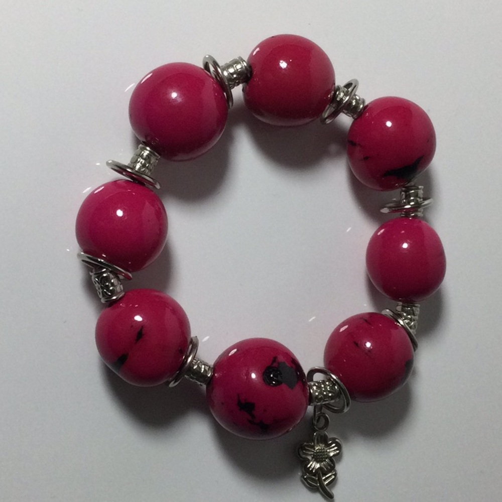 Cute Tagua Seed bracelet fuchsia. 10% discount.